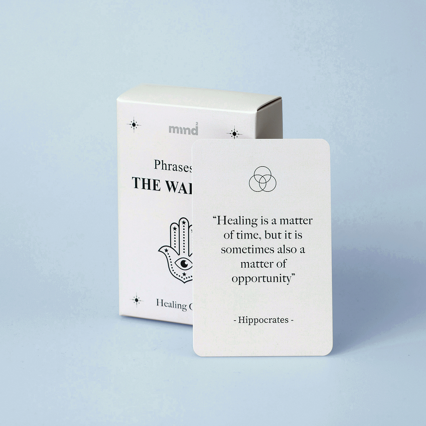 card standing next to cards deck