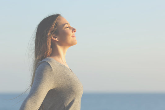 woman practicing somatic breathing